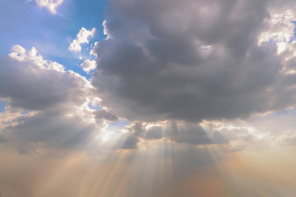 the sun's rays passing through the clouds and shining.